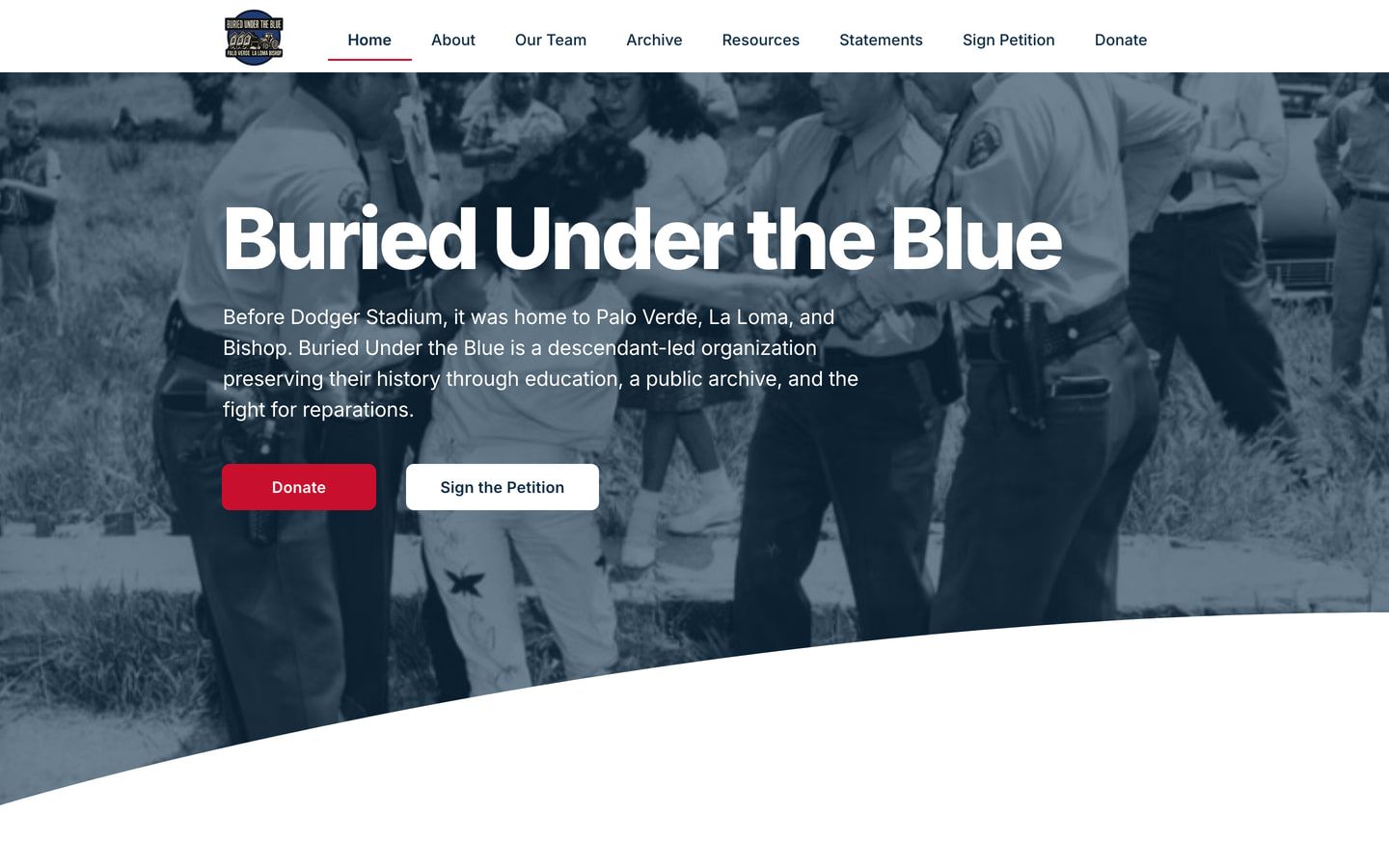 The new homepage: the organization's name, one line explaining who they are, and Donate and Sign the Petition buttons over a photograph